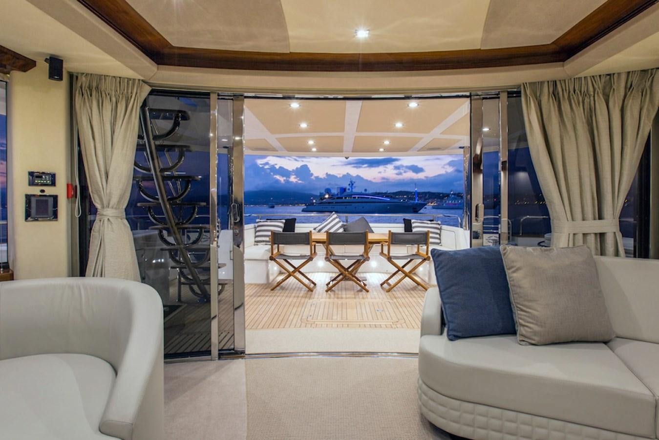 a room with a couch and chairs aboard GELATO Yacht for Sale