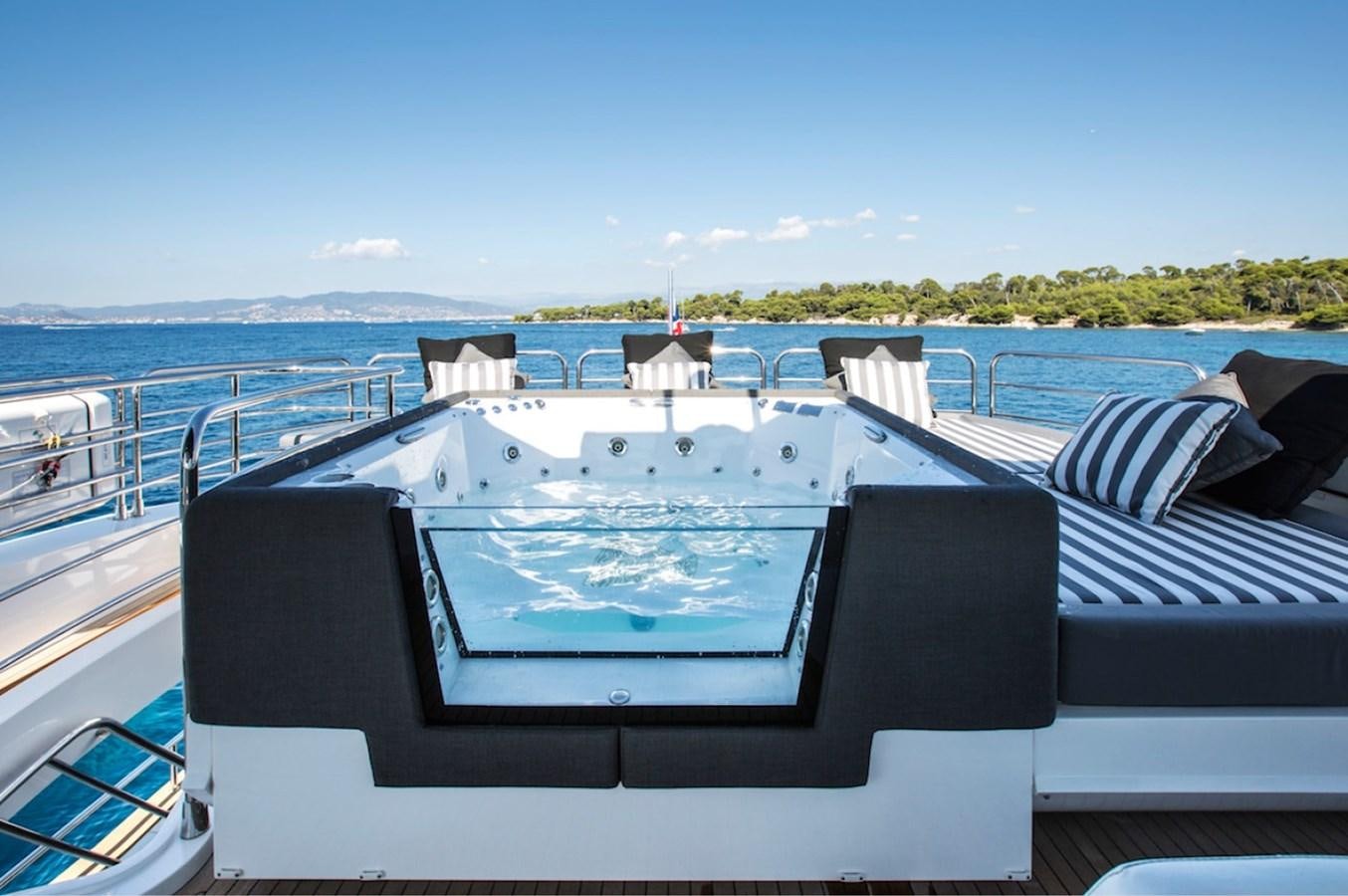 a large white boat on a body of water aboard GELATO Yacht for Sale
