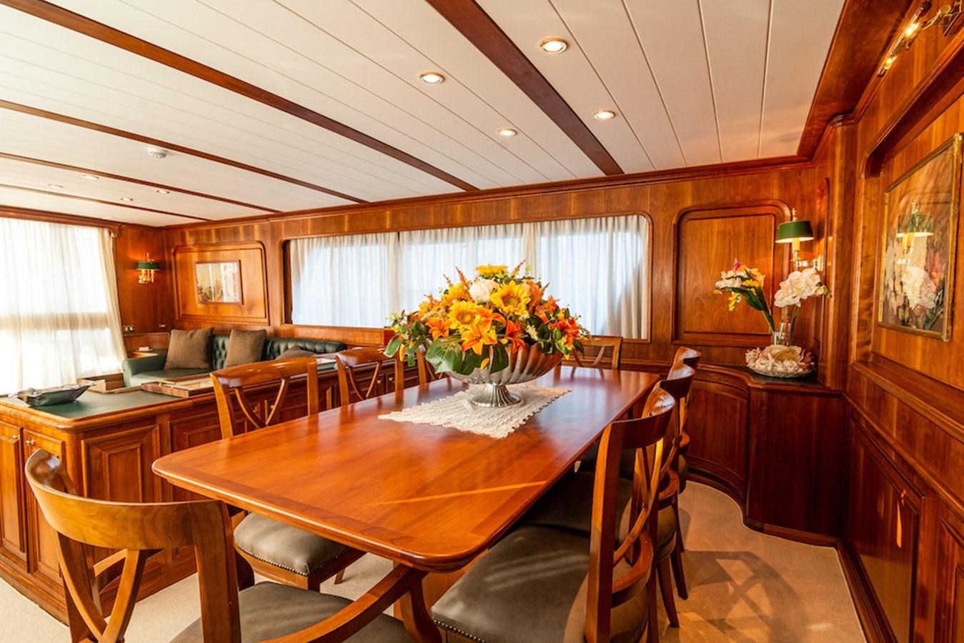 a dining room with a table aboard A&A Yacht for Sale