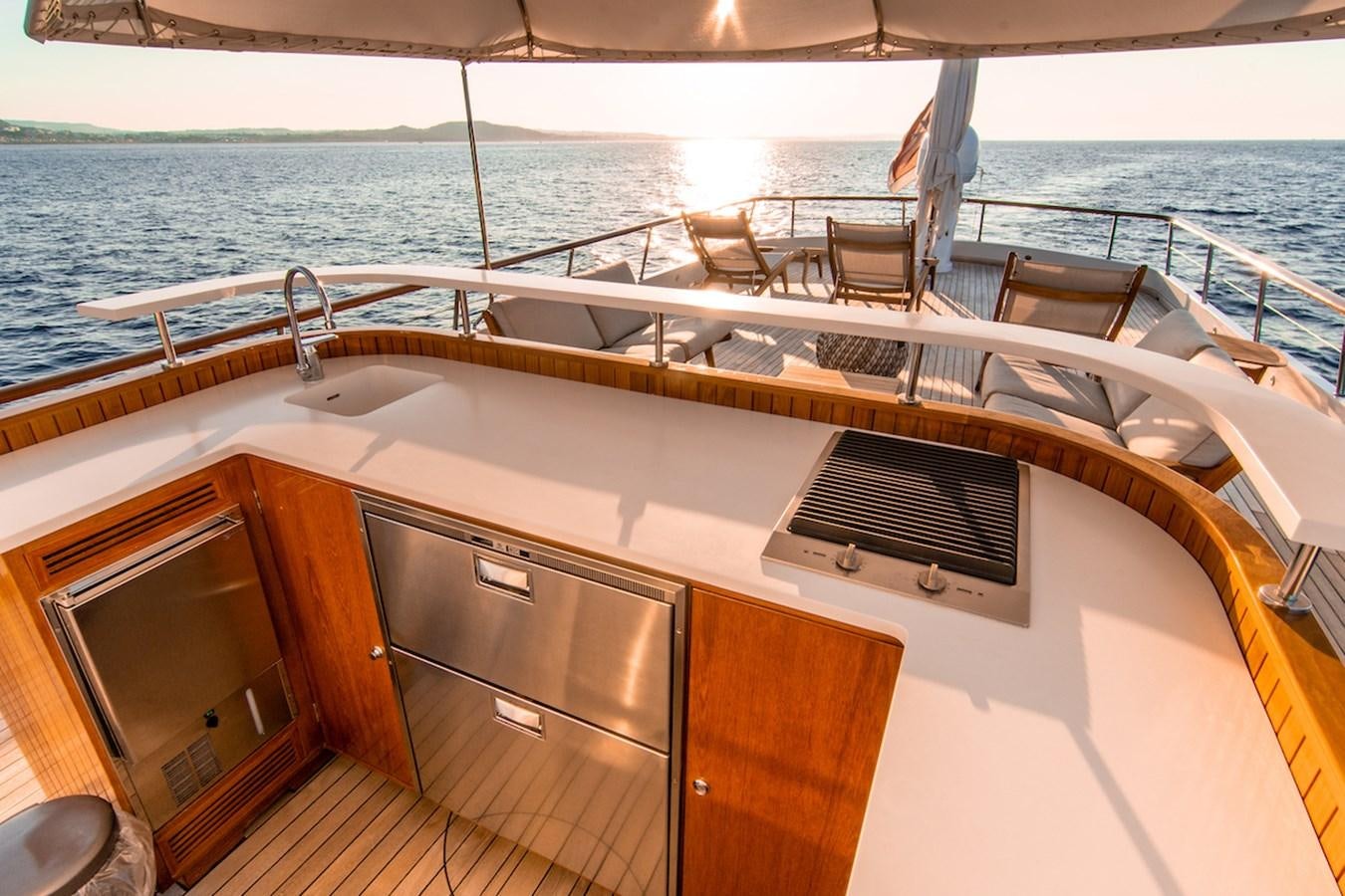 a boat with a sink and chairs on the deck aboard A&A Yacht for Sale