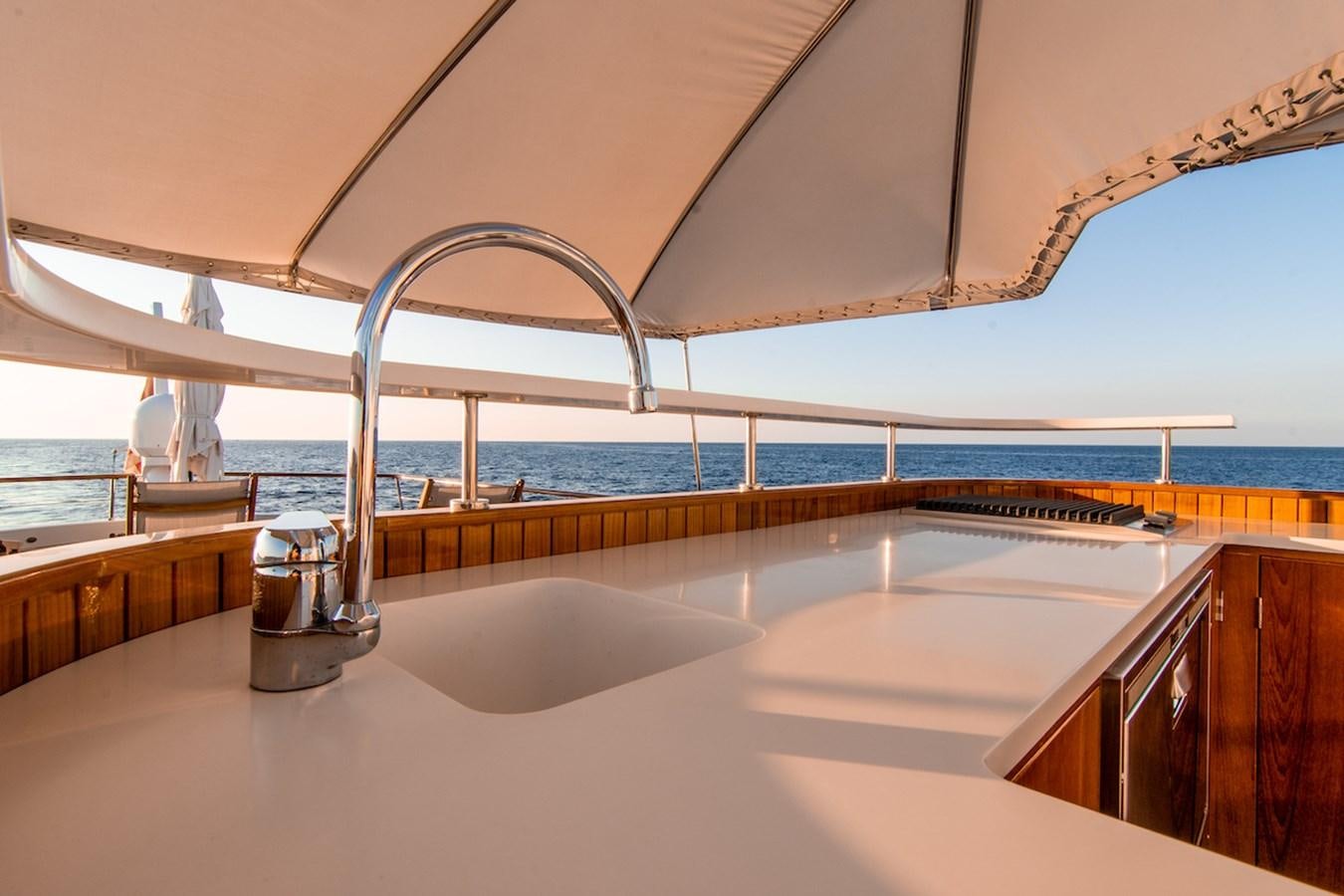 a large kitchen with a large window aboard A&A Yacht for Sale