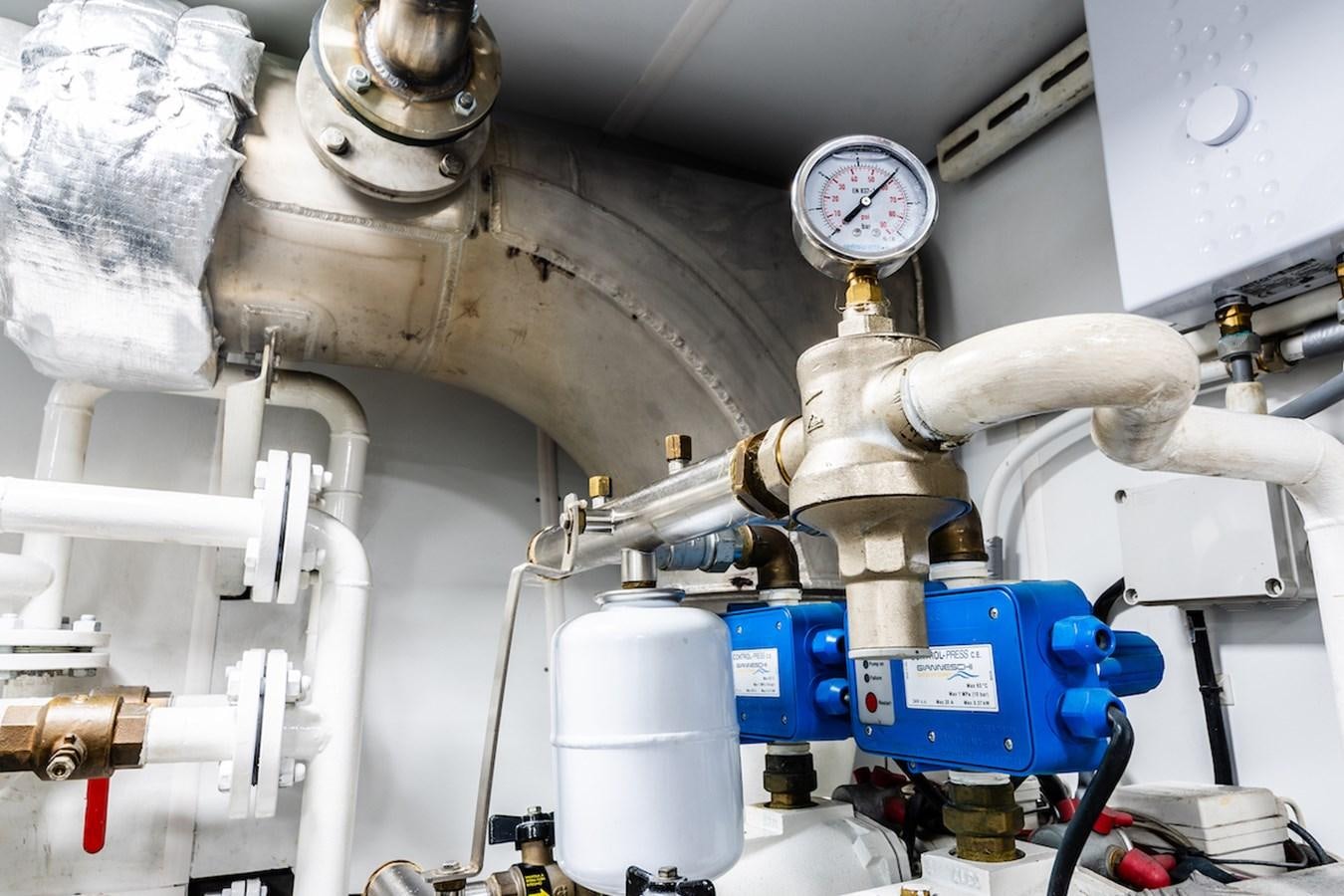 a machine in a room aboard A&A Yacht for Sale