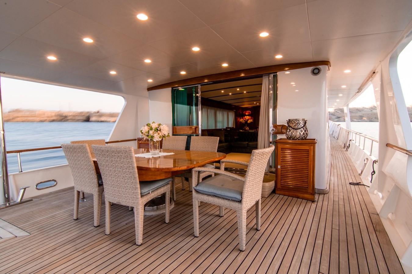 a dining room with a table and chairs aboard A&A Yacht for Sale