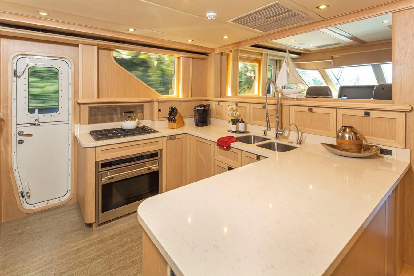 a kitchen with a large island aboard 92 PARAGON COCKPIT Yacht for Sale