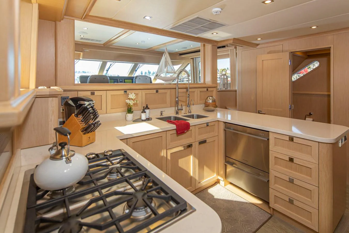 a kitchen with a stove and sink aboard 92 PARAGON COCKPIT Yacht for Sale