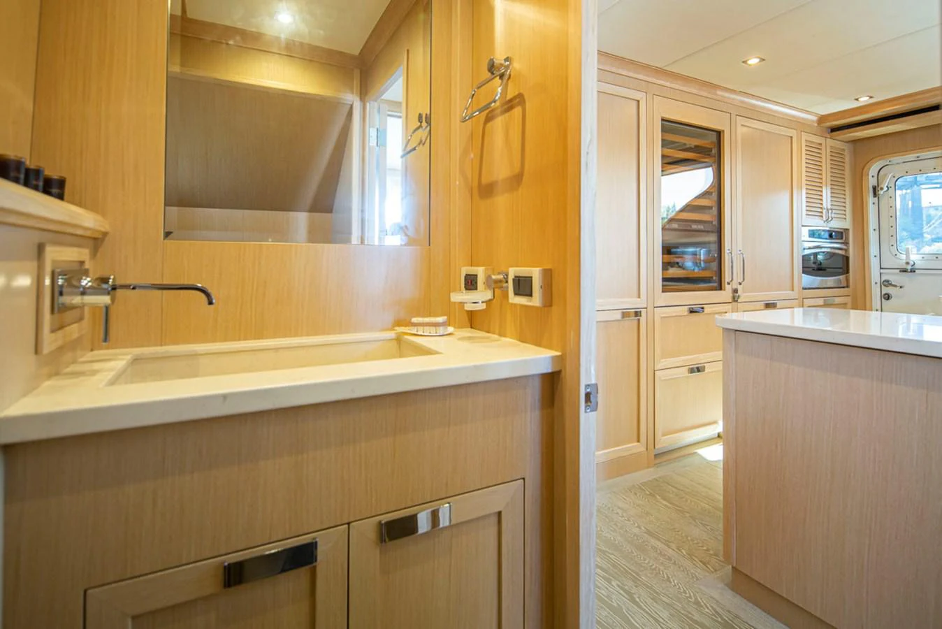 a bathroom with a sink and cabinets aboard 92 PARAGON COCKPIT Yacht for Sale