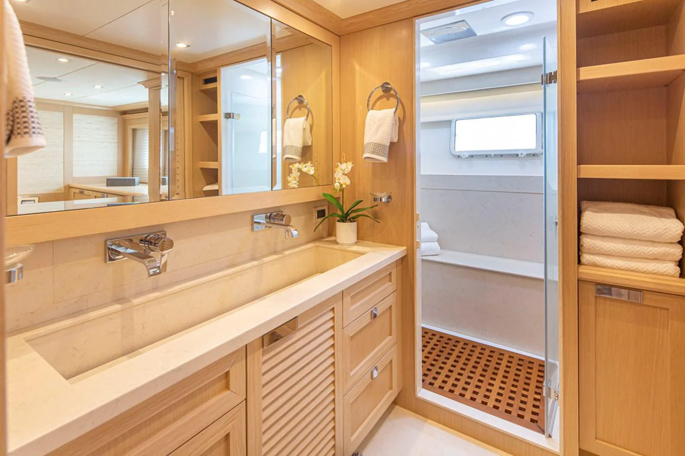 a bathroom with a sink and a mirror aboard 92 PARAGON COCKPIT Yacht for Sale