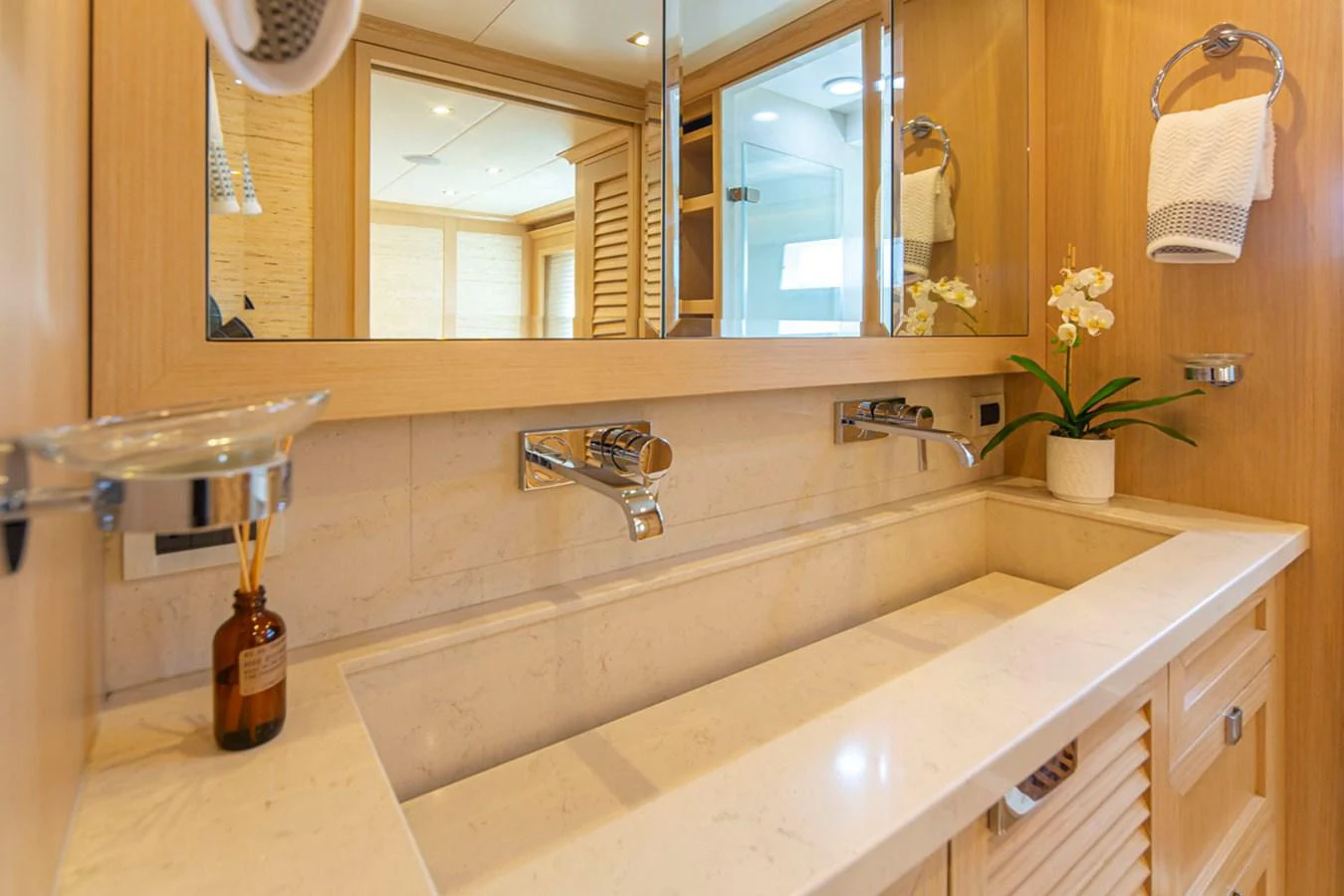 a bathroom with a sink and a mirror aboard 92 PARAGON COCKPIT Yacht for Sale