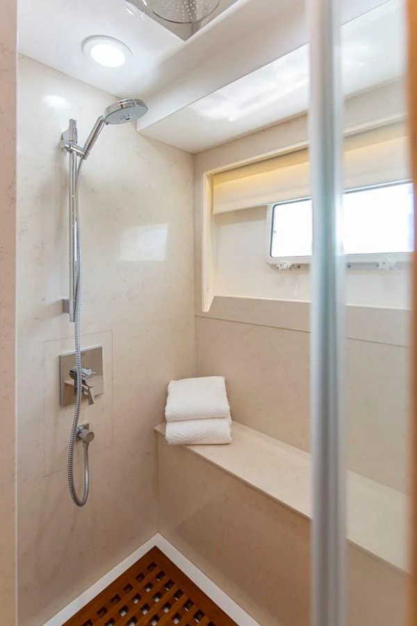 a shower with a glass door aboard 92 PARAGON COCKPIT Yacht for Sale