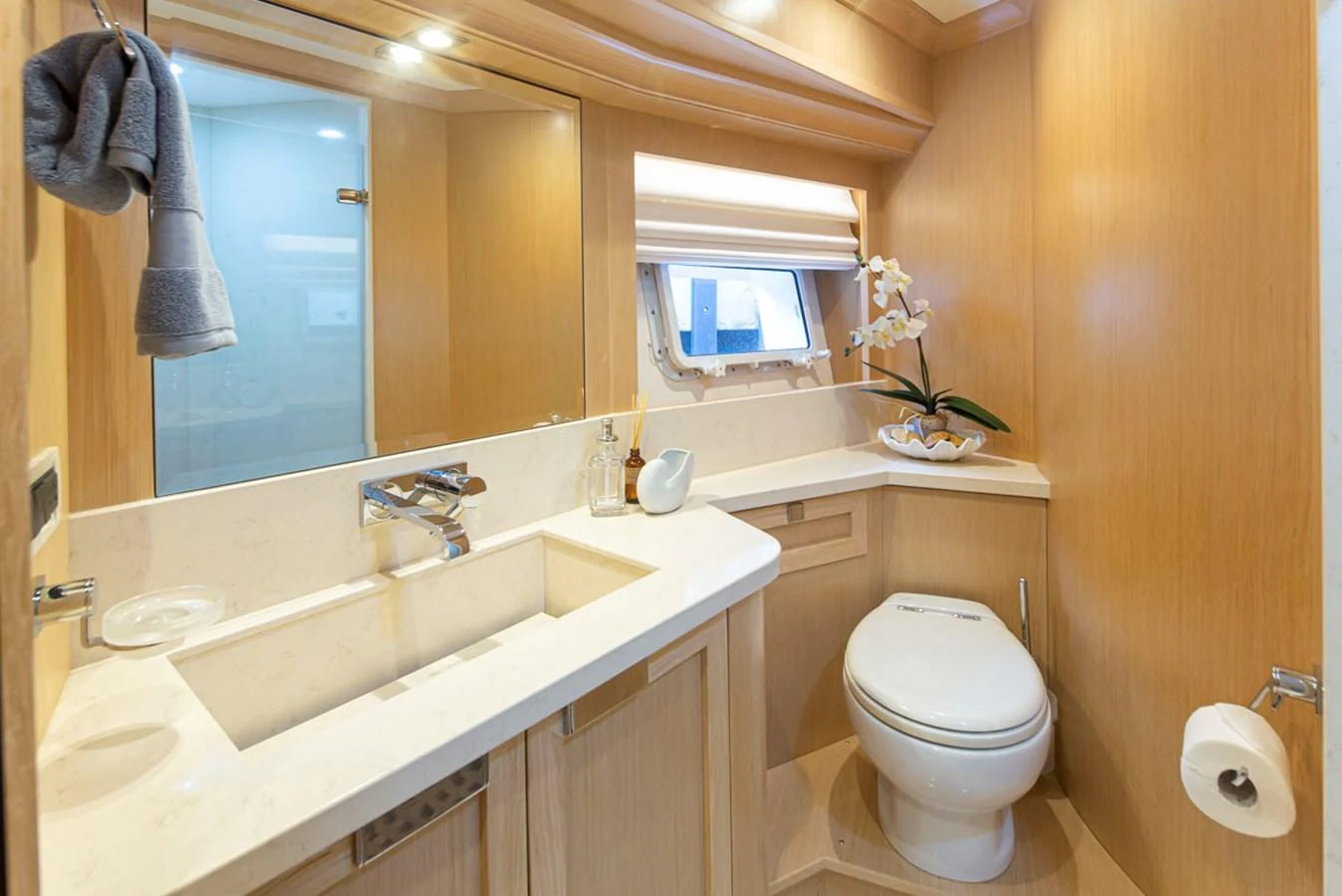 a bathroom with a toilet and sink aboard 92 PARAGON COCKPIT Yacht for Sale