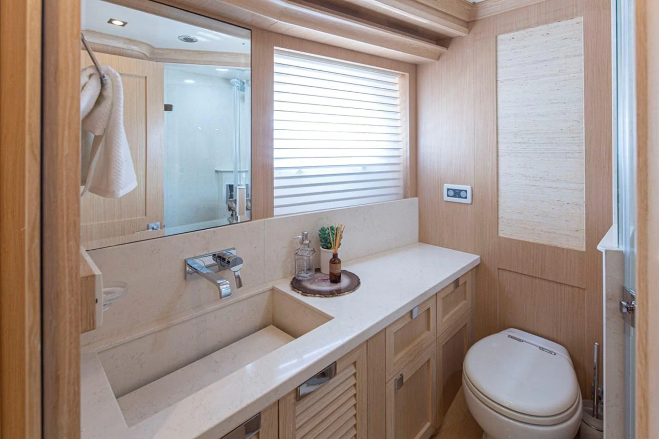 a bathroom with a sink and toilet aboard 92 PARAGON COCKPIT Yacht for Sale
