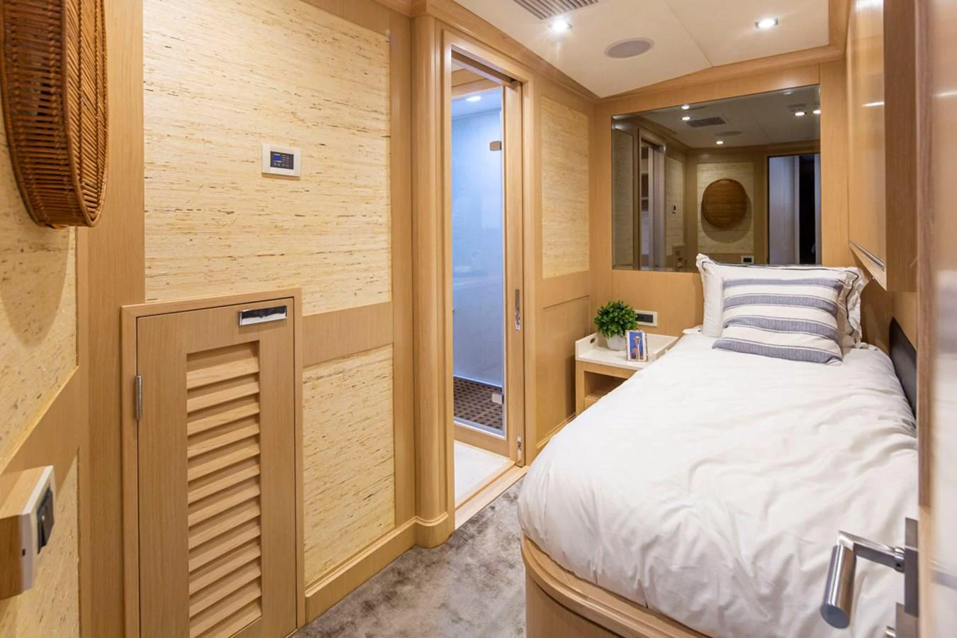a bedroom with a bed and a mirror aboard 92 PARAGON COCKPIT Yacht for Sale