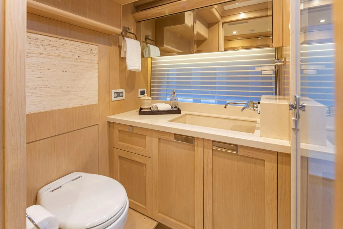 a bathroom with a sink and a toilet aboard 92 PARAGON COCKPIT Yacht for Sale