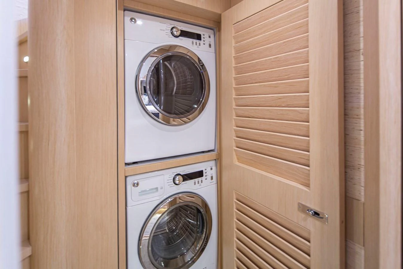 a closet with a washing machine aboard 92 PARAGON COCKPIT Yacht for Sale