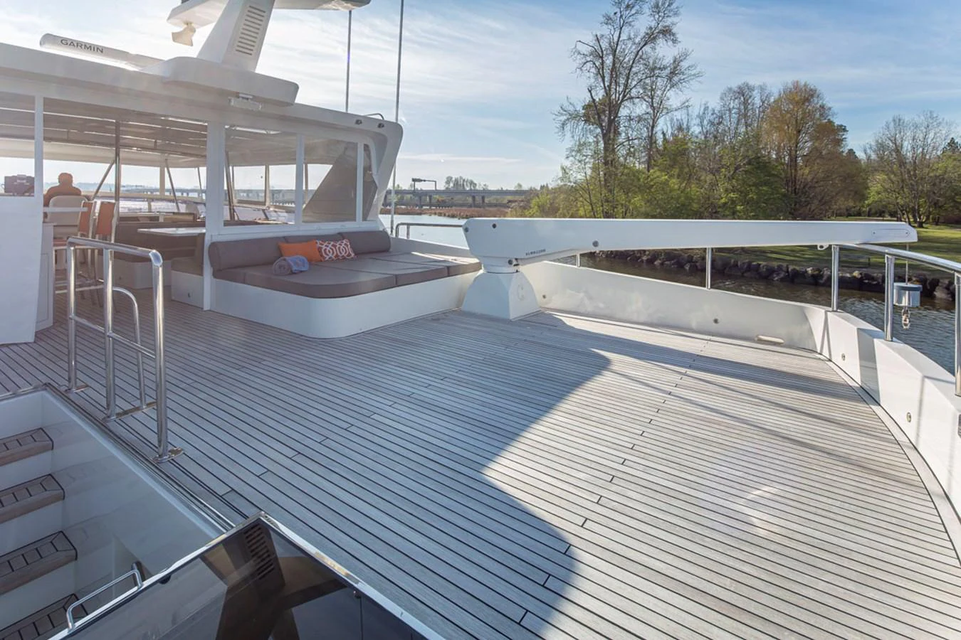 a deck with a railing and a body of water in the background aboard 92 PARAGON COCKPIT Yacht for Sale
