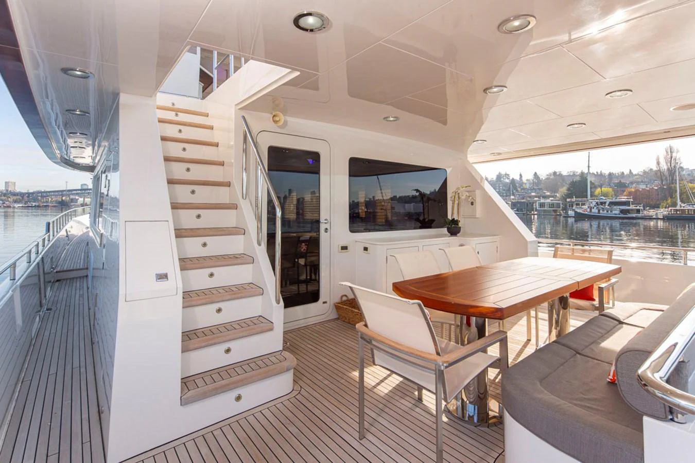 a room with a table and chairs aboard 92 PARAGON COCKPIT Yacht for Sale