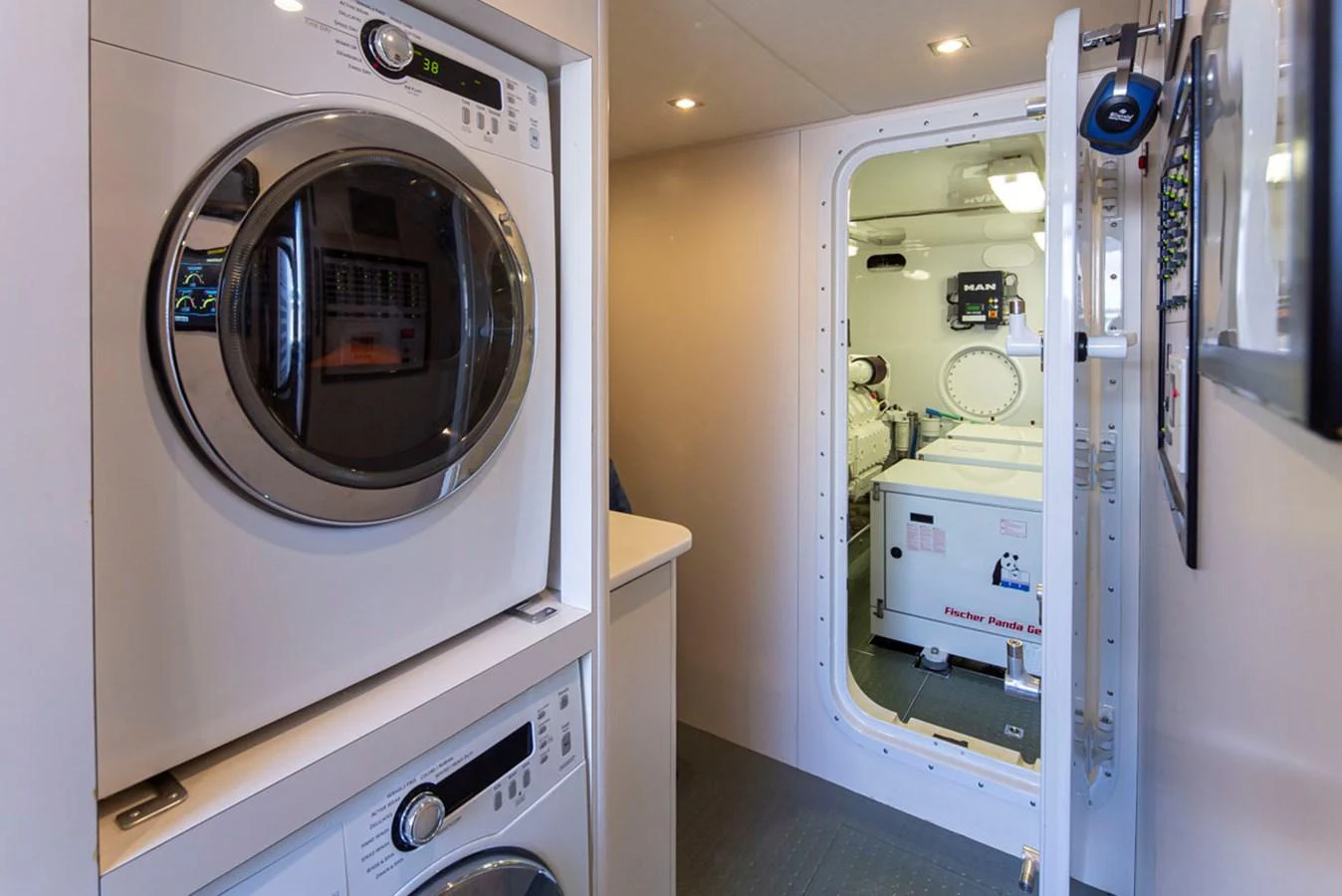 a laundry room with a washing machine aboard 92 PARAGON COCKPIT Yacht for Sale