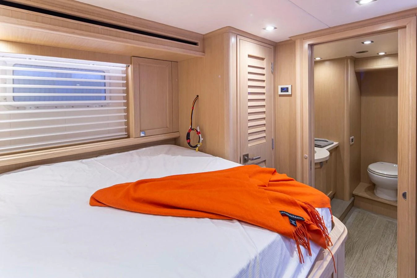a bedroom with a bed and a closet aboard 92 PARAGON COCKPIT Yacht for Sale