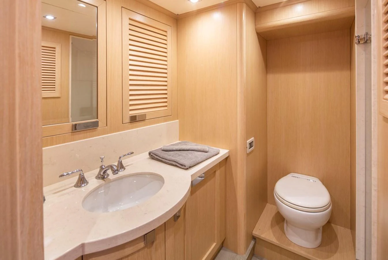 a bathroom with a toilet and sink aboard 92 PARAGON COCKPIT Yacht for Sale