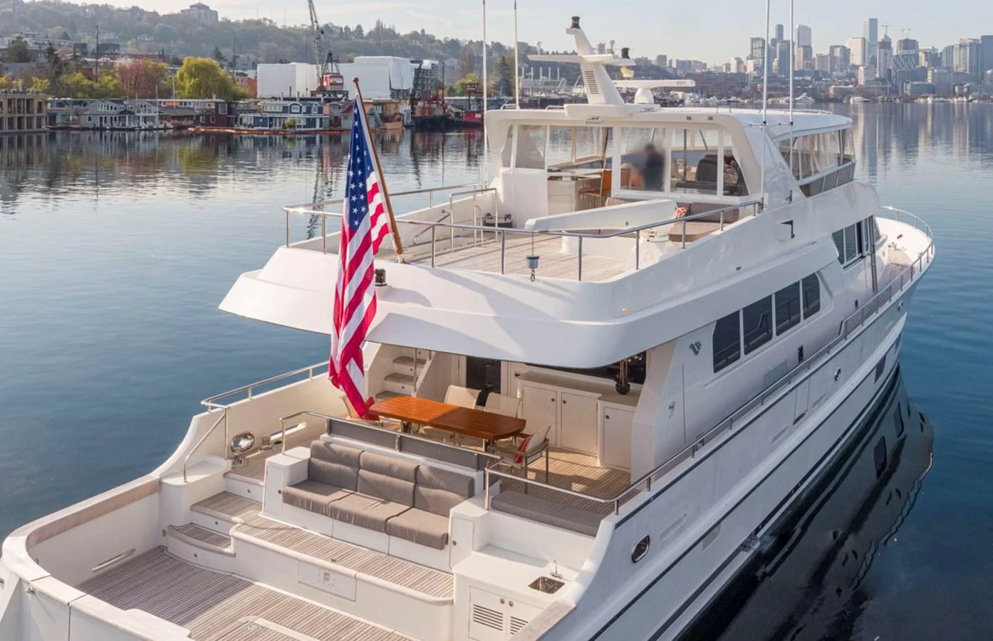 a boat with a flag on it aboard 92 PARAGON COCKPIT Yacht for Sale