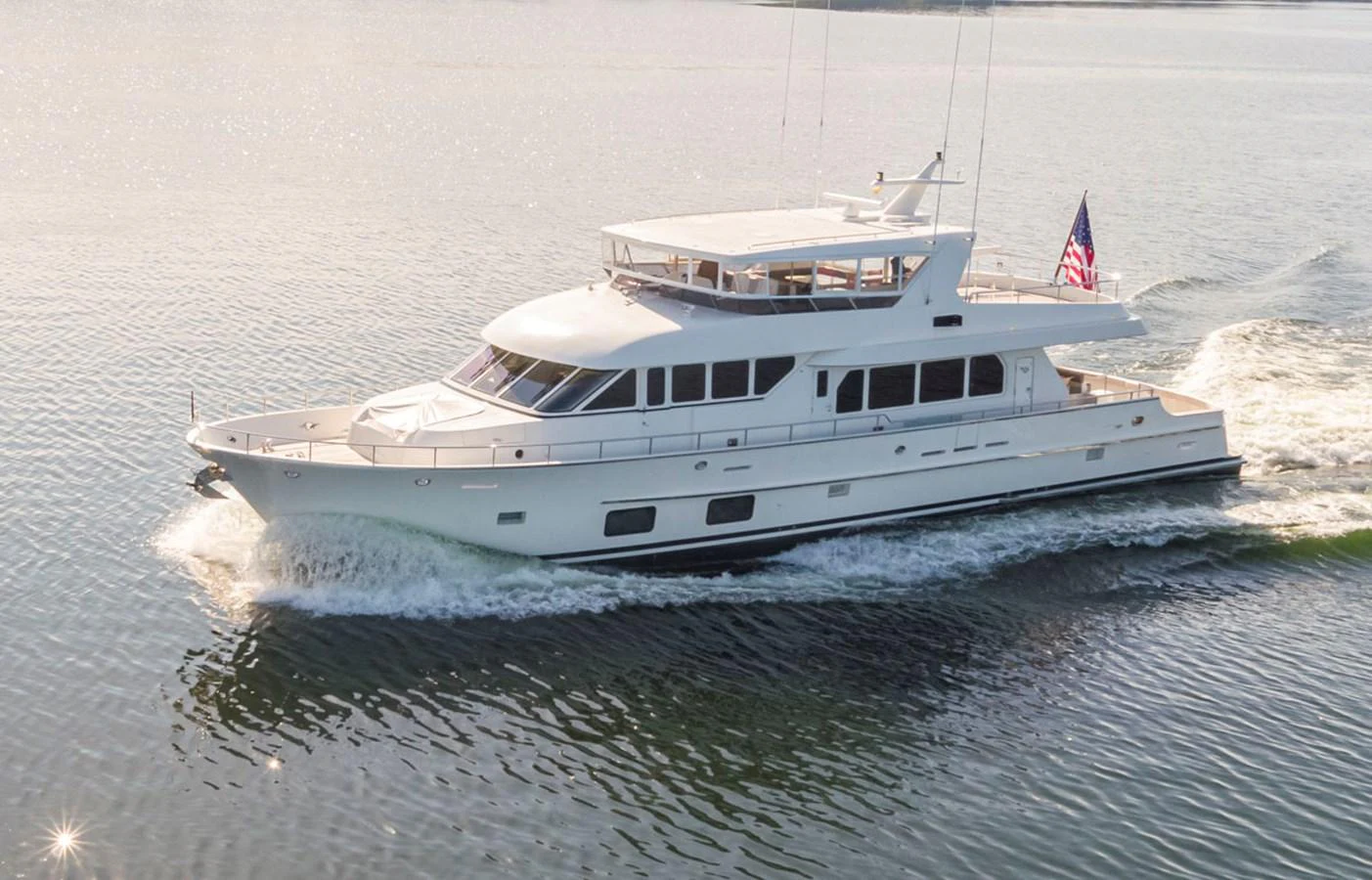 a large white boat on the water aboard 92 PARAGON COCKPIT Yacht for Sale