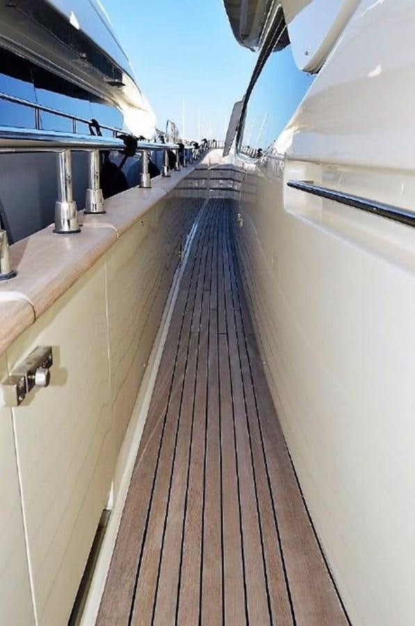 a long wooden walkway aboard BLACK SWAN Yacht for Sale