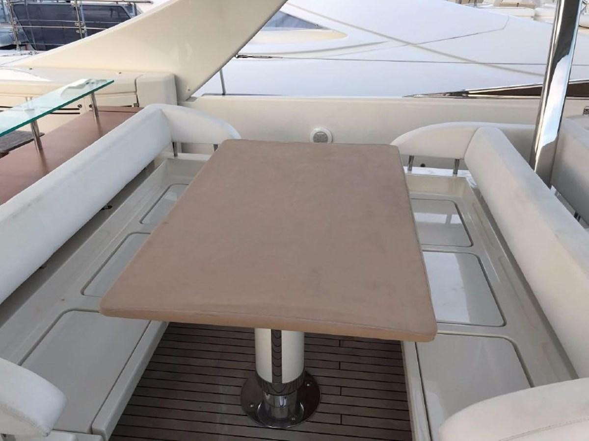 a wooden table on a boat aboard BLACK SWAN Yacht for Sale
