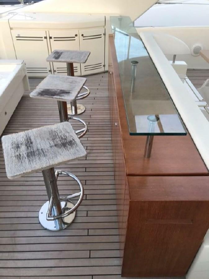 a wheelchair on a wooden floor aboard BLACK SWAN Yacht for Sale