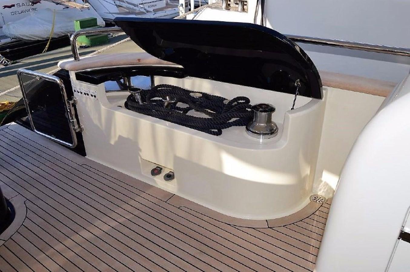 a record player on a wooden floor aboard BLACK SWAN Yacht for Sale