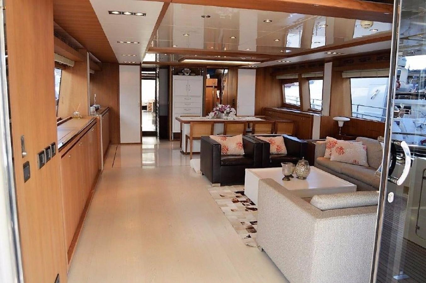 a living room with a couch and a table aboard BLACK SWAN Yacht for Sale