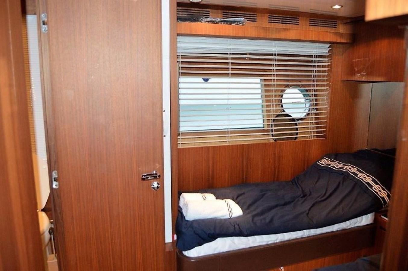 a bed in a room aboard BLACK SWAN Yacht for Sale