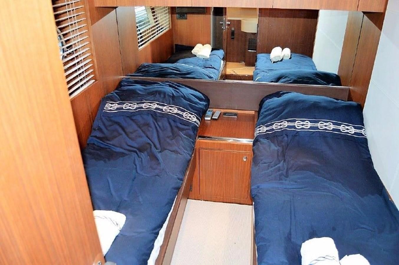 a room with bunk beds aboard BLACK SWAN Yacht for Sale