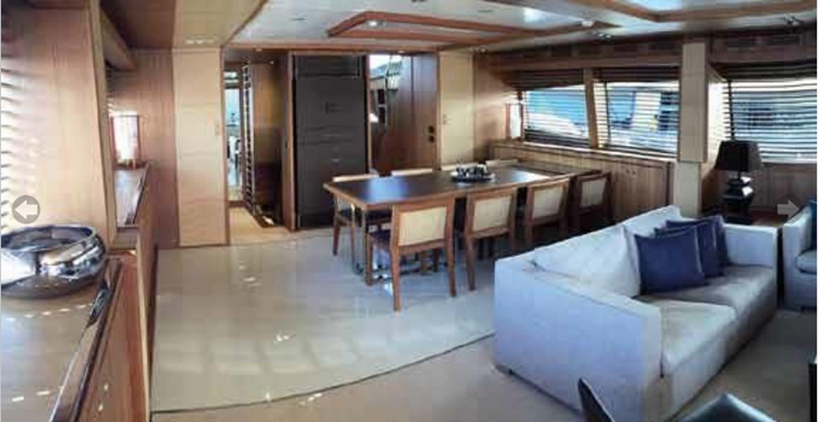 a living room with a couch and a table aboard TAURUS Yacht for Sale