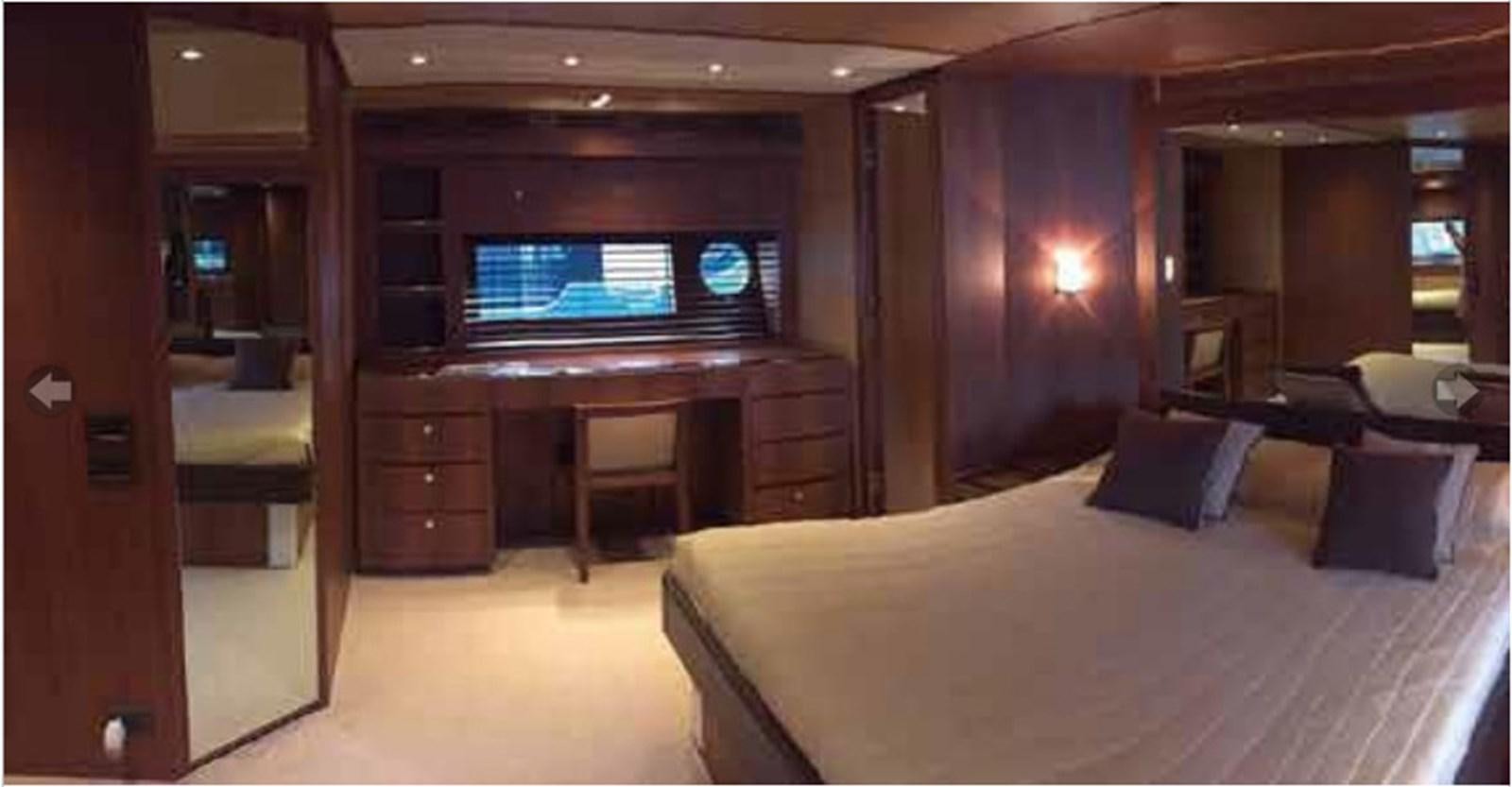 a hotel room with a bed and tv aboard TAURUS Yacht for Sale