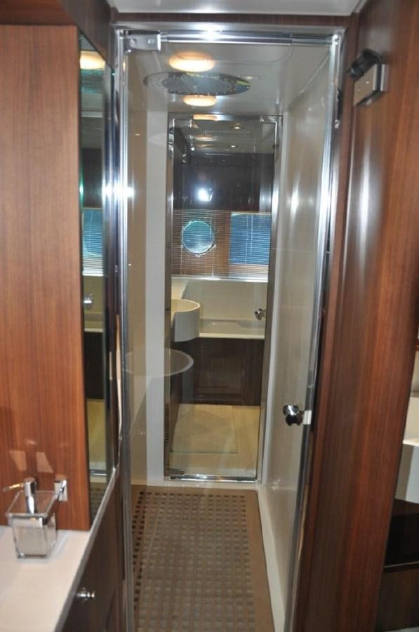a bathroom with a glass shower aboard TAURUS Yacht for Sale