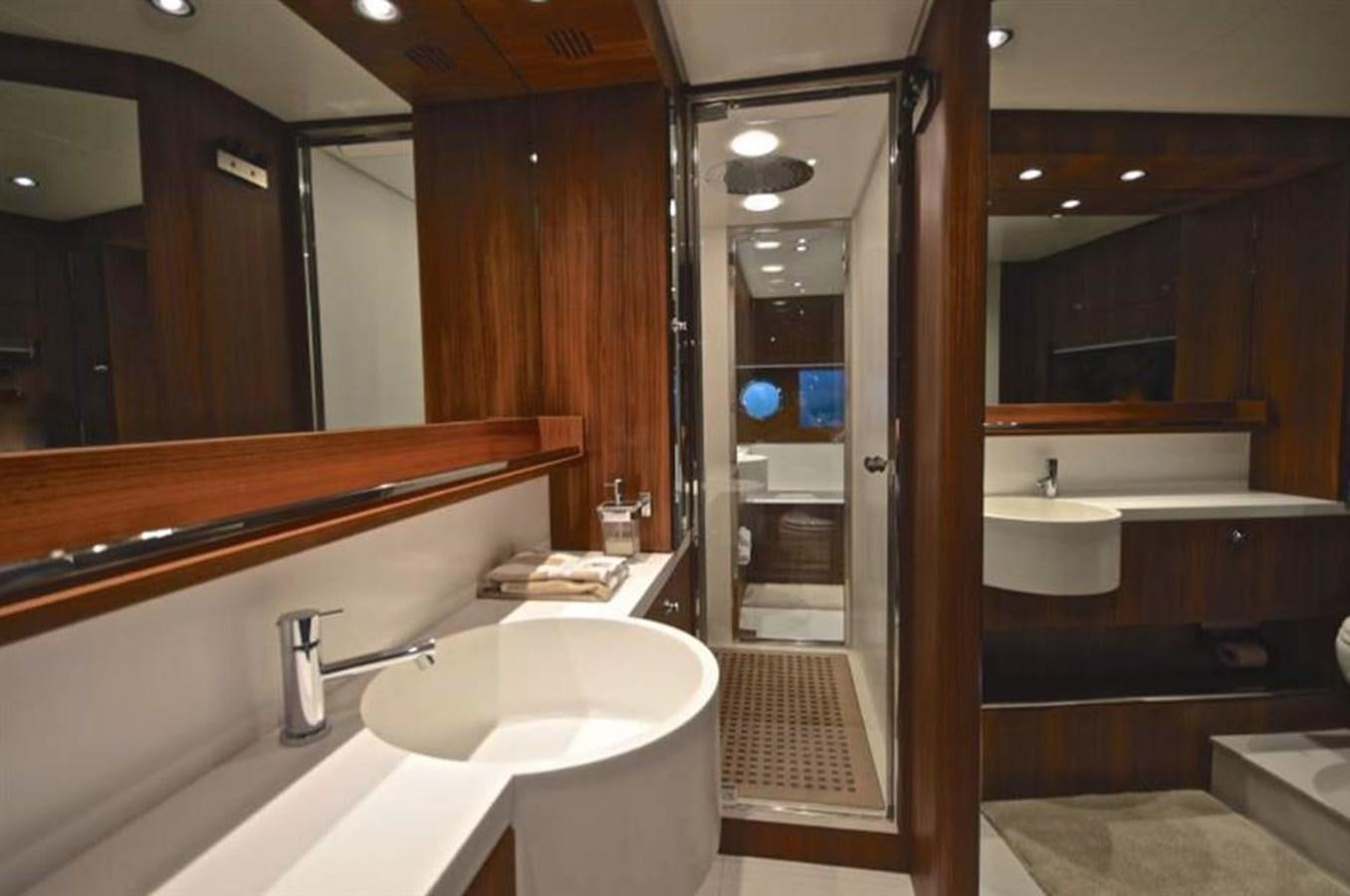 a bathroom with sinks and mirrors aboard TAURUS Yacht for Sale