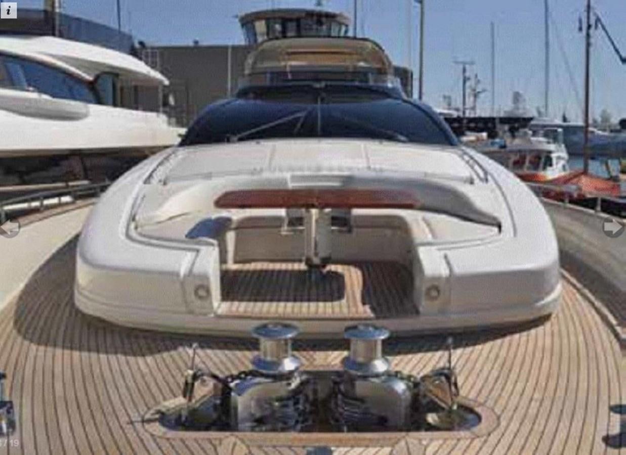 a white car with a large engine aboard TAURUS Yacht for Sale
