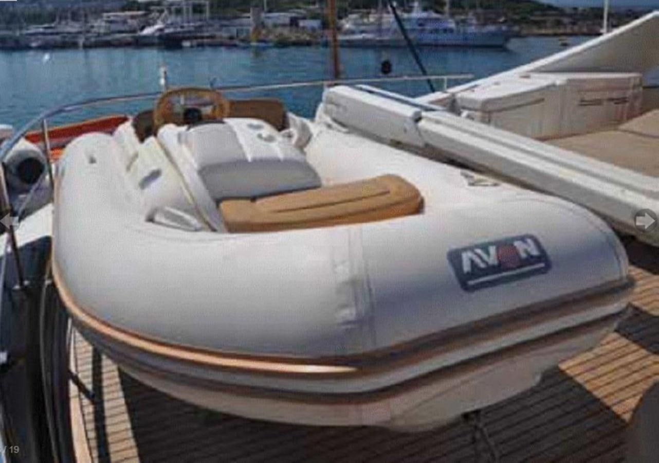 a white boat with a steering wheel aboard TAURUS Yacht for Sale
