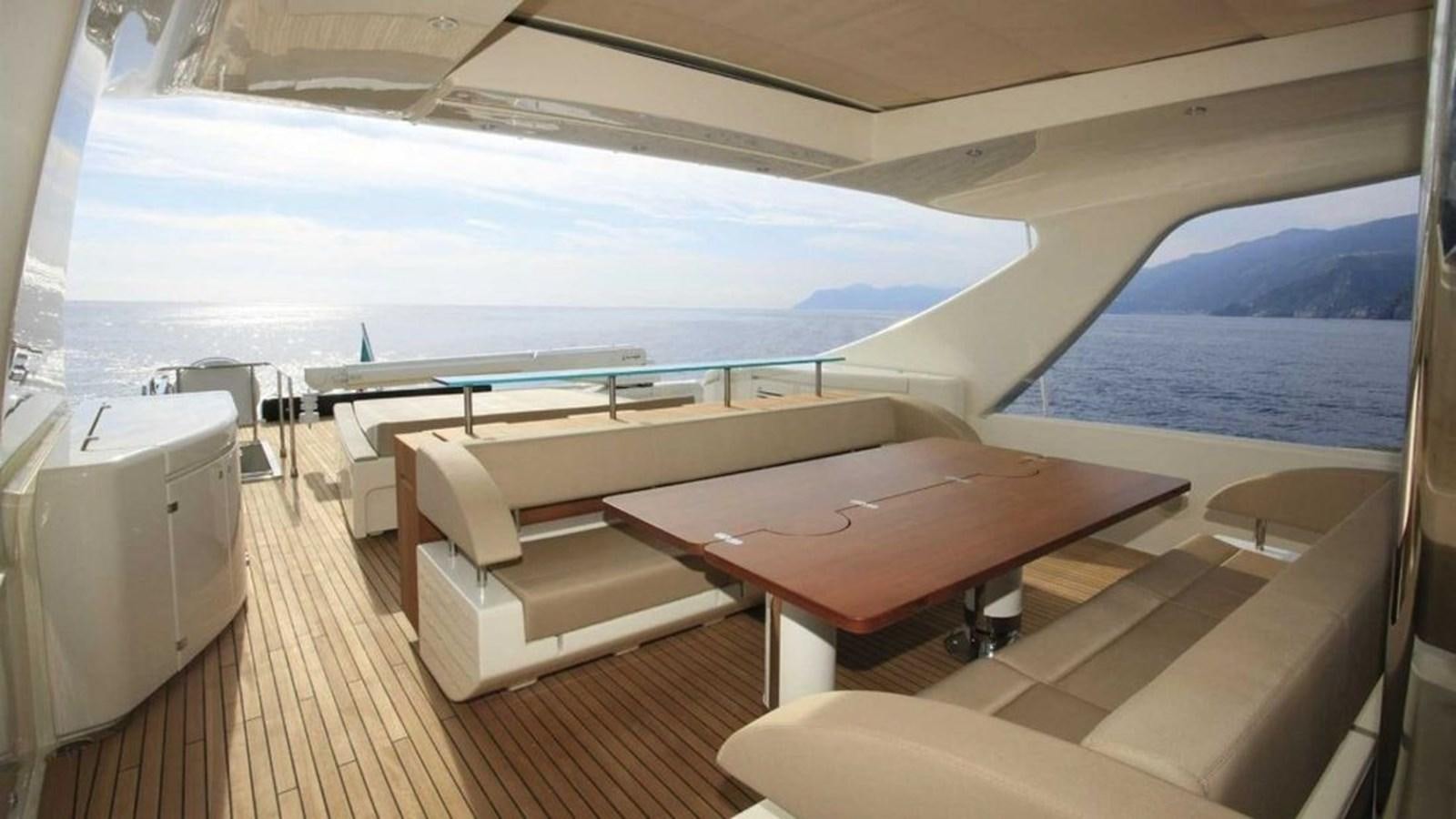 a room with a table and chairs aboard TAURUS Yacht for Sale