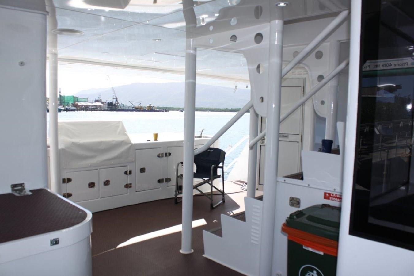 a room with a chair and a table aboard MUSHI KHAN Yacht for Sale