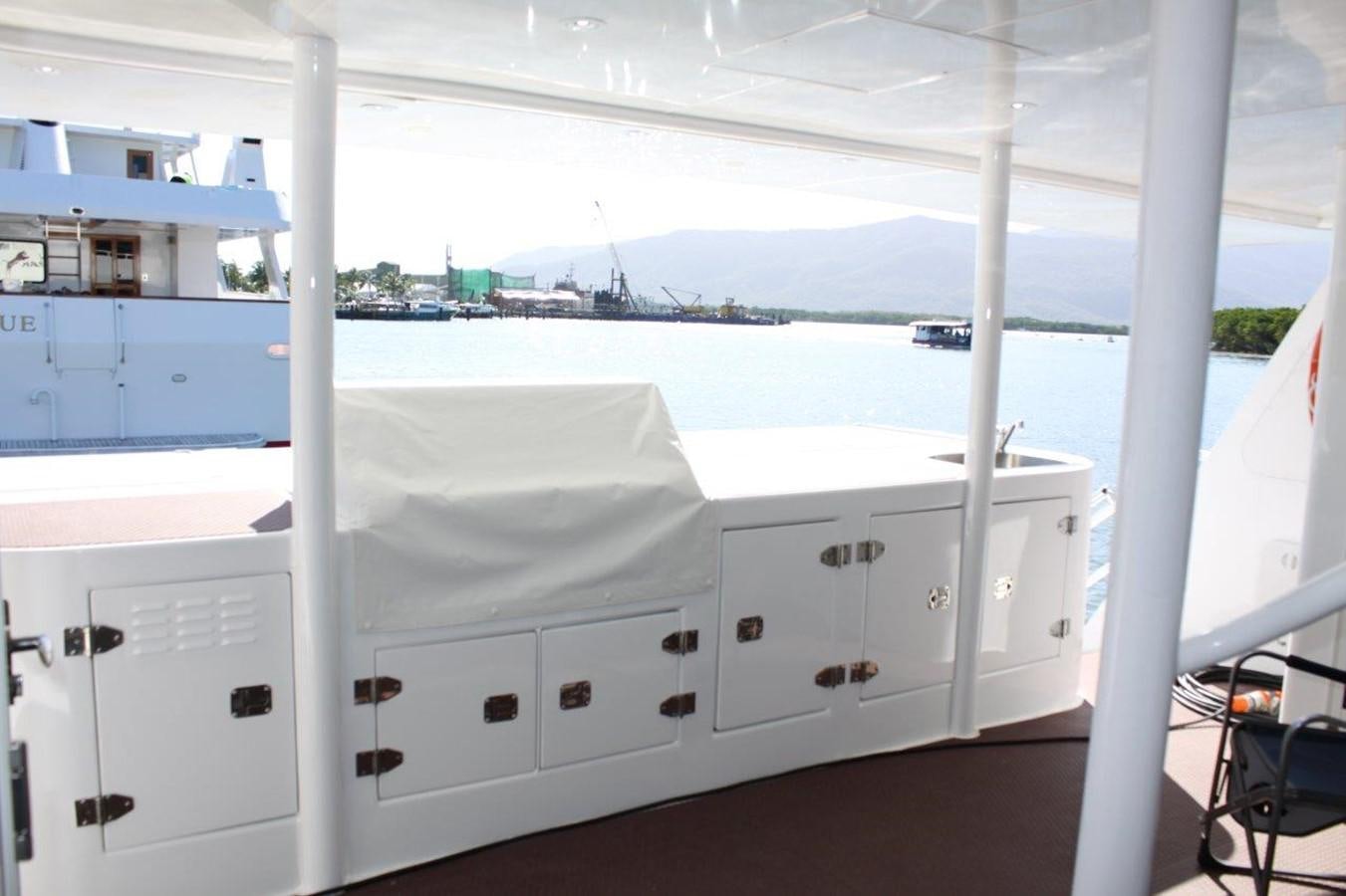 a white room with white cabinets aboard MUSHI KHAN Yacht for Sale