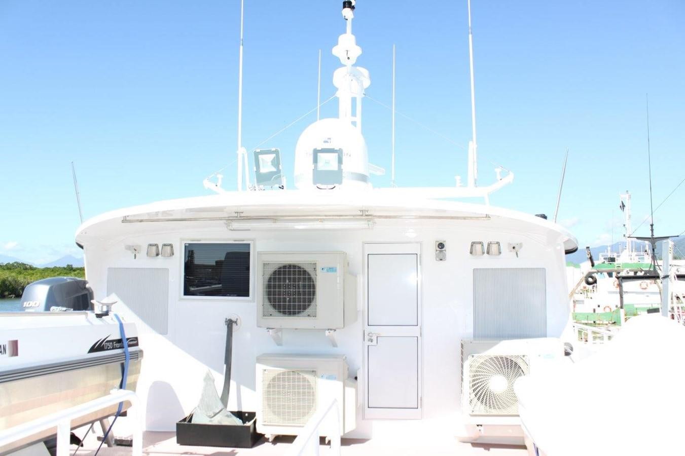 a white boat with a white tower aboard MUSHI KHAN Yacht for Sale