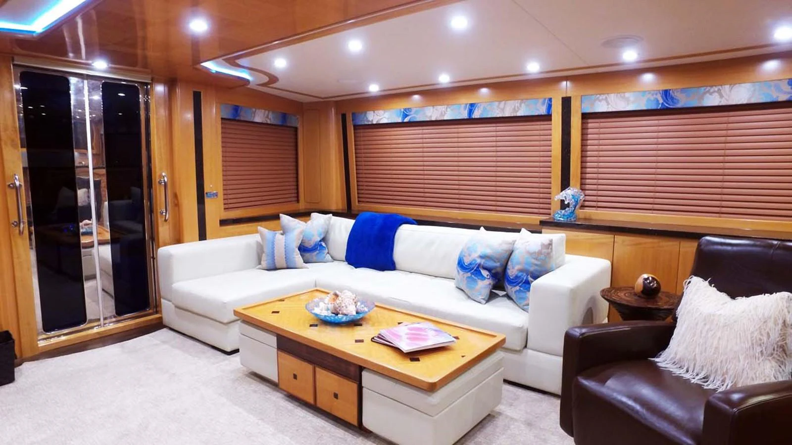 a living room with a couch and a table aboard SILKY Yacht for Sale