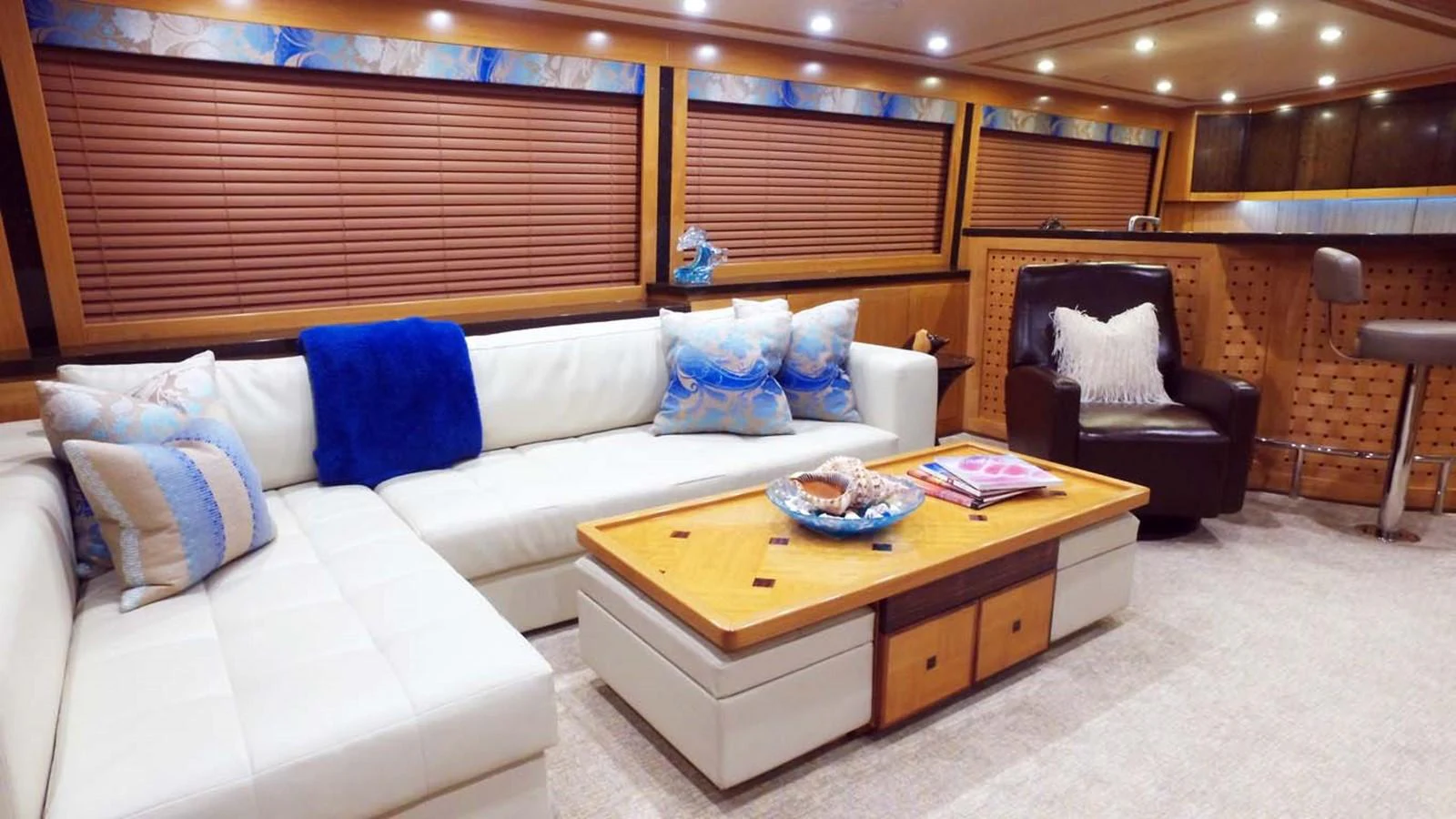 a living room with a couch and a table aboard SILKY Yacht for Sale
