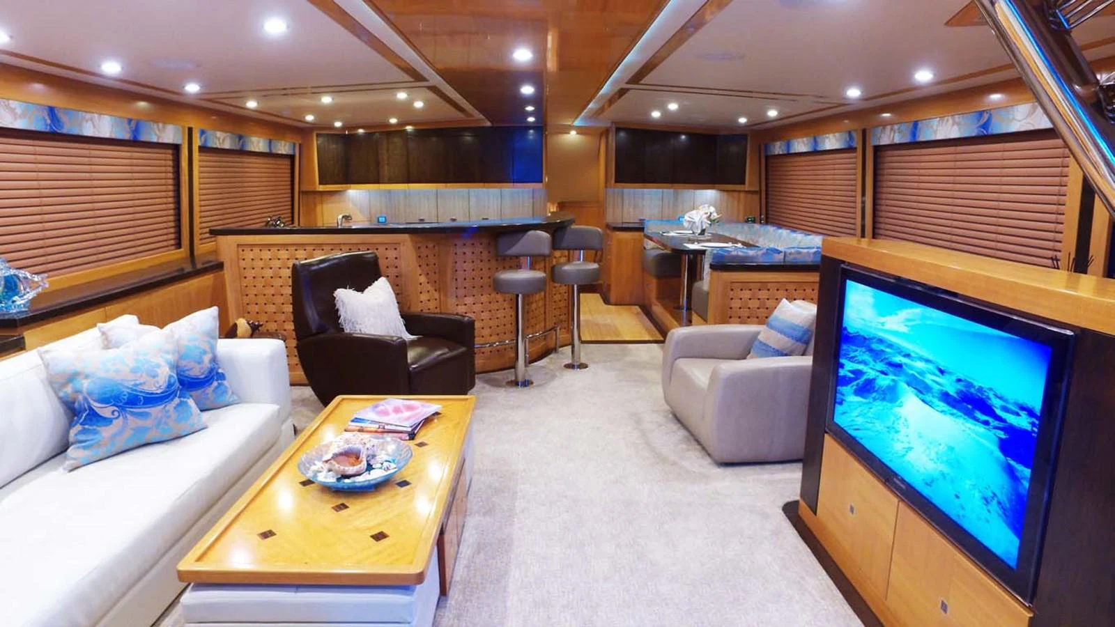a living room with a large screen aboard SILKY Yacht for Sale