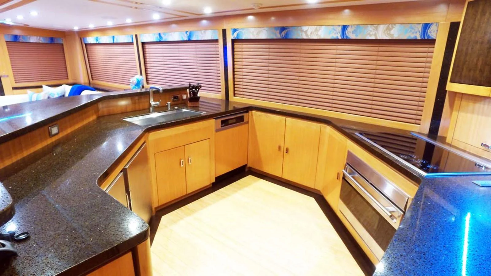 a kitchen with wooden cabinets aboard SILKY Yacht for Sale