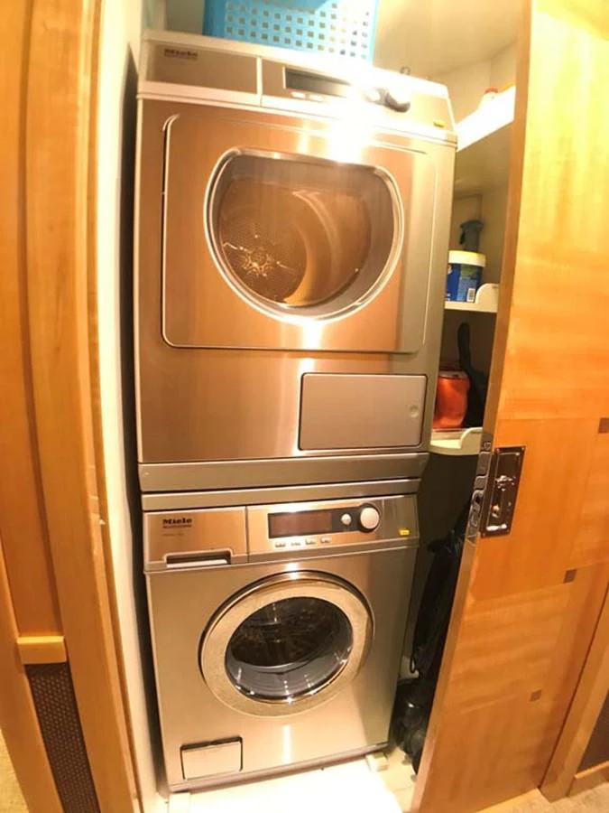 a washer and dryer in a room aboard SILKY Yacht for Sale