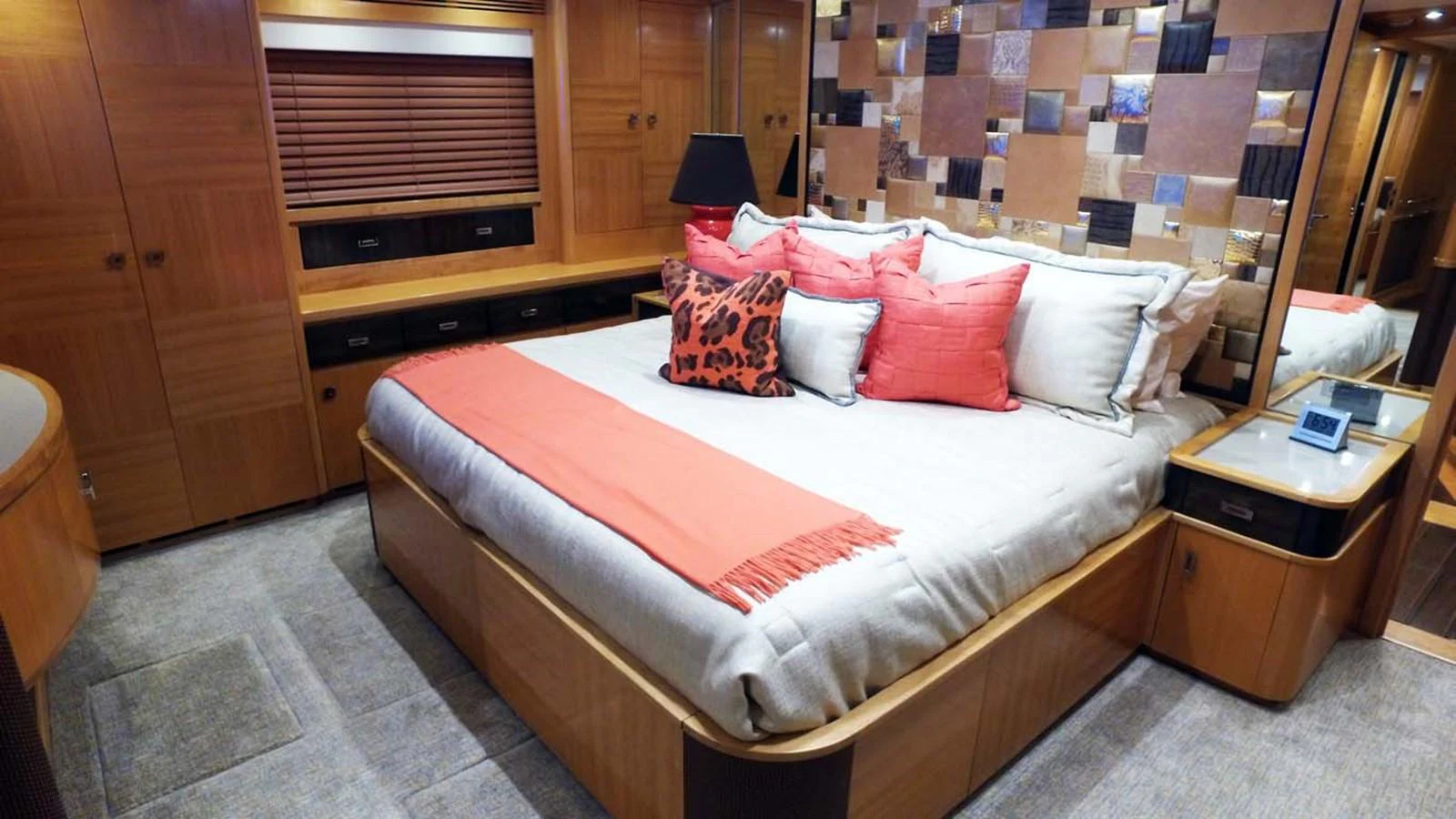 a bed with red and white pillows aboard SILKY Yacht for Sale