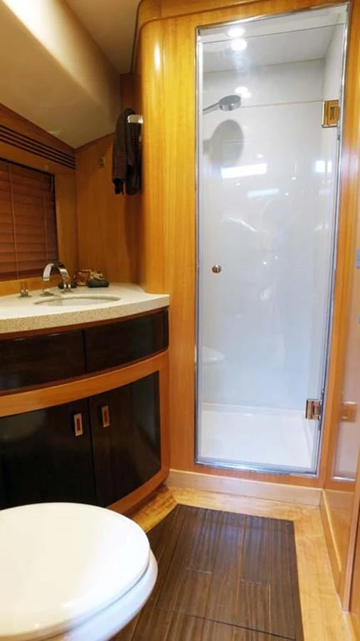 a bathroom with a shower unit and sink aboard SILKY Yacht for Sale
