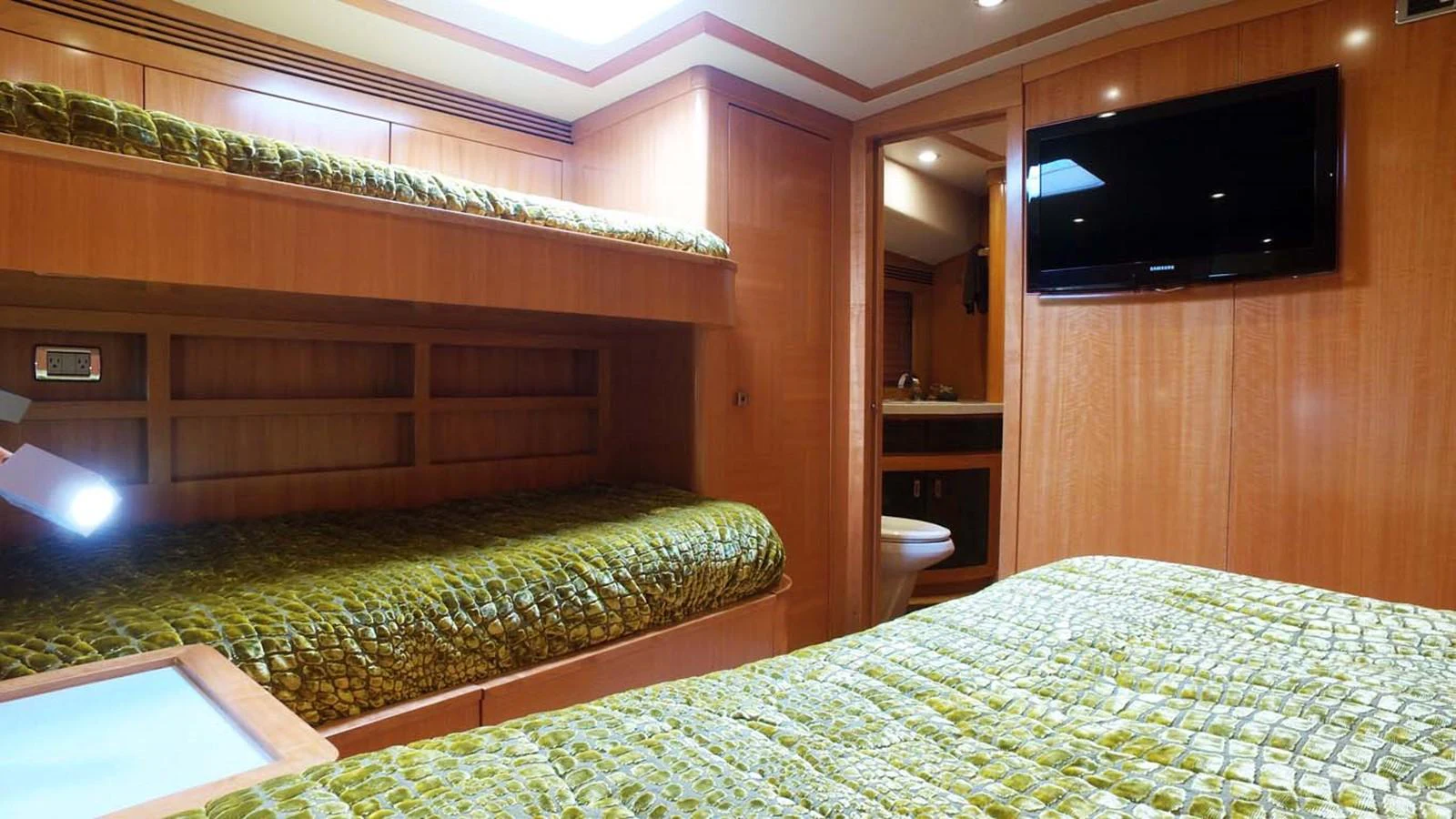 a room with a bed and a tv aboard SILKY Yacht for Sale